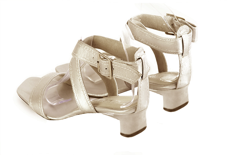 Gold women's fully open sandals, with crossed straps. Square toe. Low kitten heels. Rear view - Florence KOOIJMAN